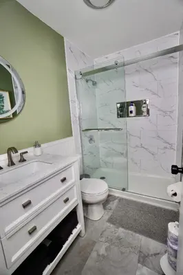 a bathroom with a shower and a toilet and a sink at Poconos Oasis with Game Room in Pocono Summit
