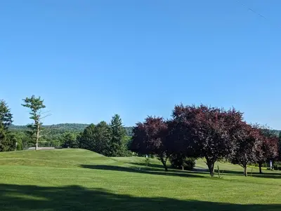 a golf course with trees on a green field at The Hidden Homestead in Lebanon