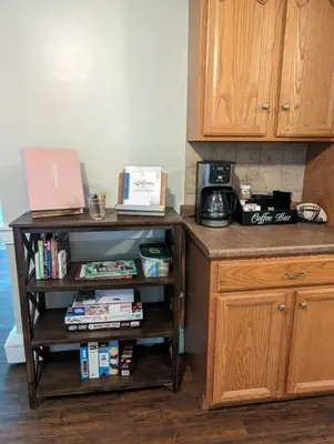 a kitchen with a counter with a laptop on a shelf at The Hidden Homestead in Lebanon