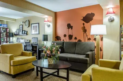a living room with a couch and chairs and a table at Sleep Inn & Suites Ronks - Lancaster Area in Ronks