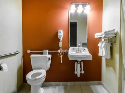 a bathroom with a toilet and a sink at Sleep Inn & Suites Ronks - Lancaster Area in Ronks