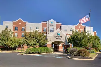 a hospital building with an american flag in front of it at Hyatt House Philadelphia/Plymouth Meeting in East Norriton