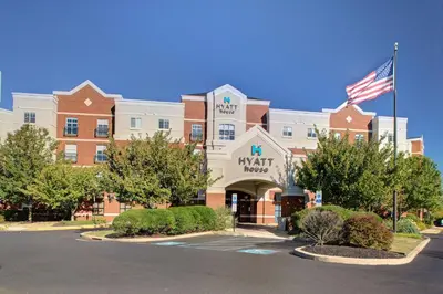 a building with an american flag in front of it at Hyatt House Philadelphia/Plymouth Meeting in East Norriton