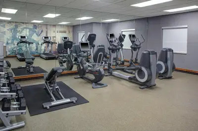a gym with several treadmills and exercise bikes at Hyatt House Philadelphia/Plymouth Meeting in East Norriton