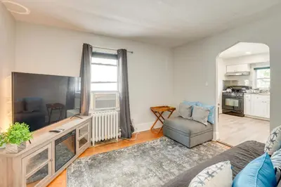a living room with a couch and a tv at Hackensack Escape with Yard - 17 Mi to Times Square! in Hackensack