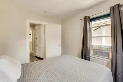 a bedroom with a bed and a window at Hackensack Escape with Yard - 17 Mi to Times Square! in Hackensack