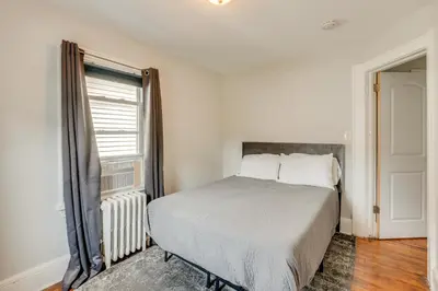 a bedroom with a bed and a window at Hackensack Escape with Yard - 17 Mi to Times Square! in Hackensack