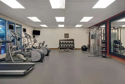 a gym with treadmills and cardio equipment in a room at Homewood Suites by Hilton Hamilton, NJ in Hamilton