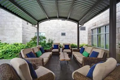a patio with couches and chairs in a building at Homewood Suites by Hilton Hamilton, NJ in Hamilton