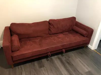 a brown leather couch sitting in a room at Private 2-bedroom apartment, free parking, direct bus to NYC Manhattan only 2 blocks away, MetLife Stadium FIFA World Cup 25 minutes away in Linden