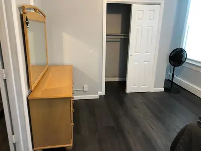 a dressing room with a mirror and a dresser at Private 2-bedroom apartment, free parking, direct bus to NYC Manhattan only 2 blocks away, MetLife Stadium FIFA World Cup 25 minutes away in Linden