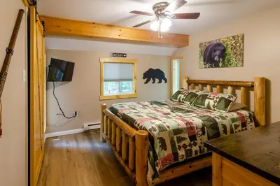 a bedroom with a bed and a ceiling fan at Hot Tub l Walk to Lake Harmony l Minutes to Ski in Lake Harmony