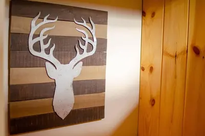 a picture of a painting of a deer on a wall at Hot Tub l Walk to Lake Harmony l Minutes to Ski in Lake Harmony