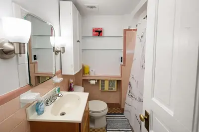 a small bathroom with a sink and a toilet at Stylish & Charming 2BR Monthly Discount in Elkins Park