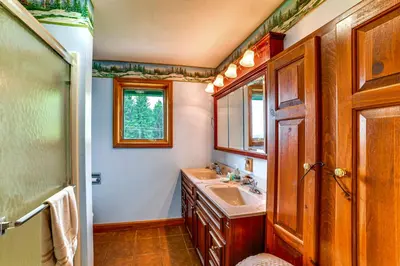 a bathroom with a sink and a mirror at Secluded Oxford Cabin on 75 Acres Sunset Views! in Oxford