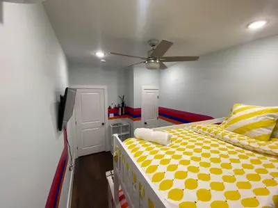 a bedroom with a bed and a ceiling fan at Heart of NY - 17 min to Empire State & Times Sq in Jersey City