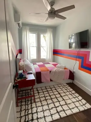 a bedroom with a bed and a window at Heart of NY - 17 min to Empire State & Times Sq in Jersey City