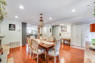 a dining room with a table and chairs at Artist Residence 3 Bedroom Brownstone in Hoboken