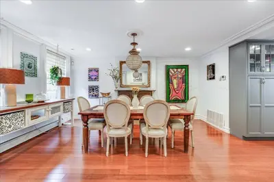 a dining room with a table and chairs at Artist Residence 3 Bedroom Brownstone in Hoboken