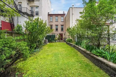 an empty yard in front of a building at Artist Residence 3 Bedroom Brownstone in Hoboken