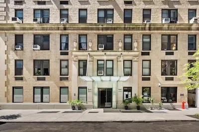 a large brick building with a door in front of it at 73-410 Luxury 24 DM New Studio UWS Gym Laundry in New York
