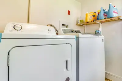 a white washer and dryer in a laundry room at Cozy Keansburg Cottage Walk to Beach and Boardwalk! in Keansburg