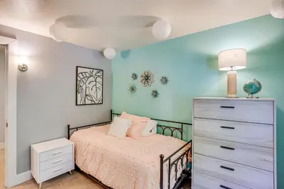 a bedroom with a bed and a dresser at 10 Mi to Hersheypark Updated Family Retreat! in Annville