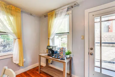 a room with a desk and a window with a computer at 10 Mi to Hersheypark Updated Family Retreat! in Annville