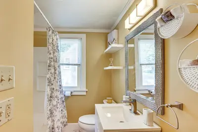 a bathroom with a sink and a toilet at 10 Mi to Hersheypark Updated Family Retreat! in Annville