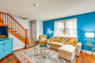 a living room with a couch and a table at 10 Mi to Hersheypark Updated Family Retreat! in Annville