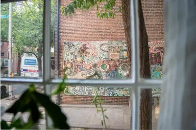 a mural on the side of a brick building at Historic Family 3BR Trinity in the Heart of Philly in Philadelphia