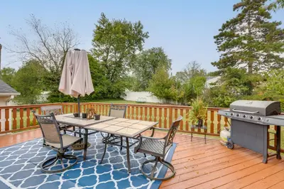 a patio with a table and chairs and a grill at Somerset Home with Large Yard Near Parks and Trails in Somerset