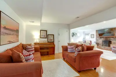a living room with two couches and a fireplace at Somerset Home with Large Yard Near Parks and Trails in Somerset