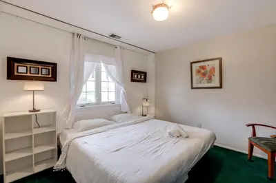 a bedroom with a white bed and a window at Somerset Home with Large Yard Near Parks and Trails in Somerset