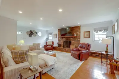 a living room with a couch and a fireplace at Somerset Home with Large Yard Near Parks and Trails in Somerset