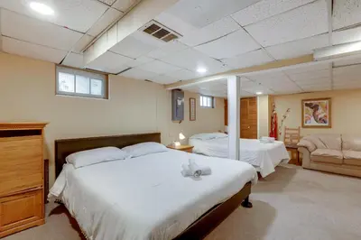 a large bedroom with two beds and a couch at Somerset Home with Large Yard Near Parks and Trails in Somerset