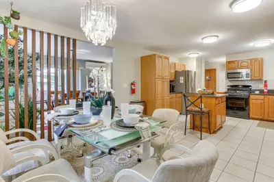 a kitchen and dining room with a table and chairs at Charming, Restful Getaway in Bushkill