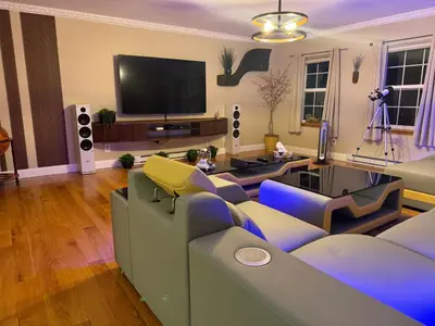 a living room with a couch and a flat screen tv at Charming, Restful Getaway in Bushkill