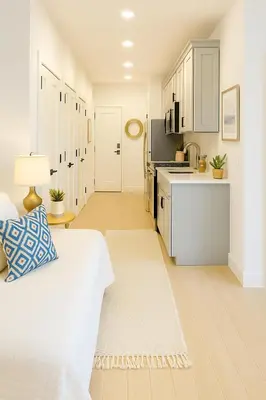 a white kitchen with a bed in a room at Luxury Stay for NYC visit Jersey City 7 Min Walk NYC Train Station in Jersey City