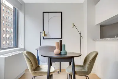 a dining room with a table and chairs at UWS 1BR w Elevator Gym nr Central Park NYC-686 in New York