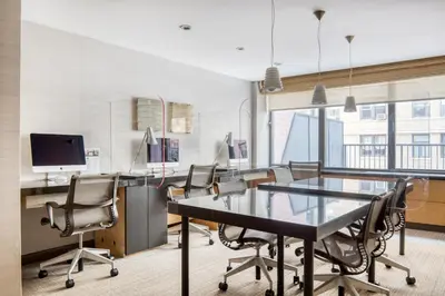 an office with a conference room with a table and chairs at UWS 1BR w Elevator Gym nr Central Park NYC-686 in New York