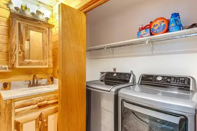 a kitchen with a stove and a washer and dryer at Game Room and Hot Tub Pine Bear Pocono Lake Cabin in Pocono Lake