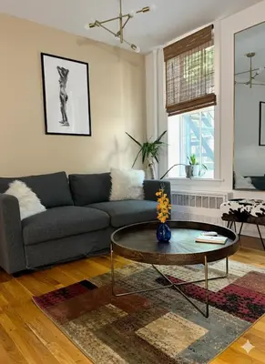 a living room with a couch and a coffee table at Beauty in the Heart of the Village in New York