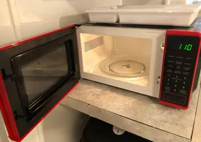 a microwave oven with its door open on a counter at Private apartment with 1 bedroom and 1 bathroom, MetLife Stadium FIFA World Cup 25 minutes away in Paterson