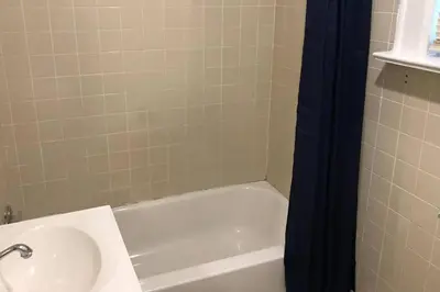 a bathroom with a sink and a bath tub at Private apartment with 1 bedroom and 1 bathroom, MetLife Stadium FIFA World Cup 25 minutes away in Paterson