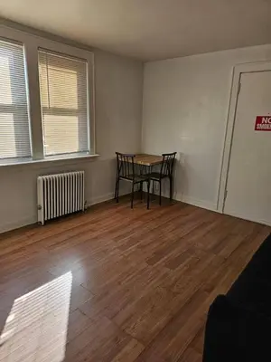 an empty room with a table and chairs in it at Private apartment with 1 bedroom and 1 bathroom, MetLife Stadium FIFA World Cup 25 minutes away in Paterson