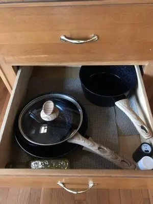 a drawer of a cabinet with a plate and a spoon at Private 1-bedroom RV, direct bus to NYC Manhattan only 2 blocks away, MetLife Stadium FIFA World Cup 25 minutes away in Linden