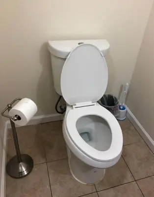 a bathroom with a toilet with a roll of toilet paper at Large and private 3 bedroom and 1 bathroom apartment near Newark International Airport EWR and New York City, MetLife Stadium FIFA World Cup 20 minutes away in Newark