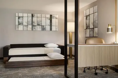 a living room with a bed and a table at SpringHill Suites by Marriott Easton PA in Easton