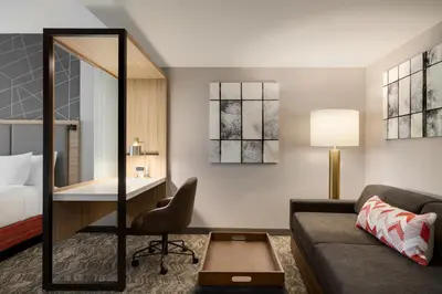a hotel room with a bed and a couch at SpringHill Suites by Marriott Easton PA in Easton